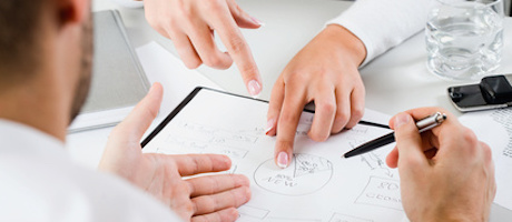 Womanís hands pointing on the resources of new project